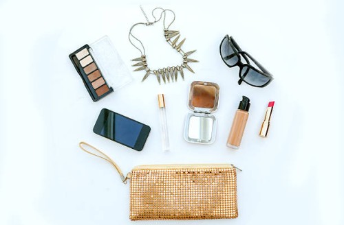 dressing case with a lot of feminine objects.yellow background - fashion stock pictures, royalty-free photos & images