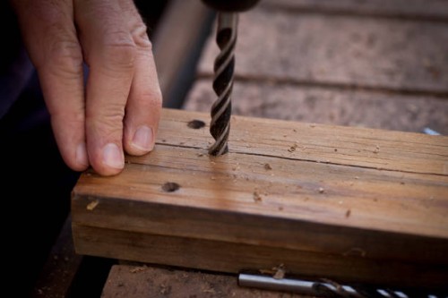 drilling into timber - home decoration stockfoto's en -beelden