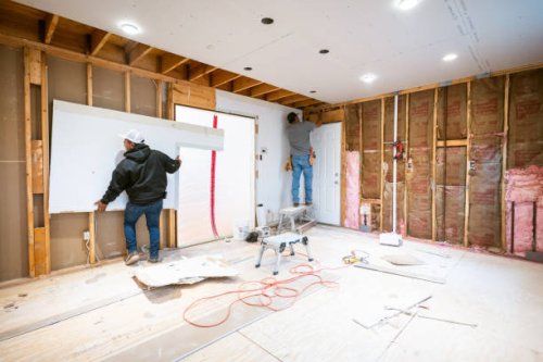 drywall installers working in kitchen renovation - home decoration stock pictures, royalty-free photos & images
