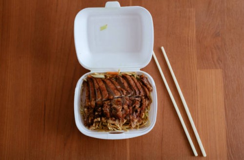 duck with noodles, asian food in a catering box from food delivery service. the new normal in covid 19 pandemic times - junk food stock pictures, royalty-free photos & images