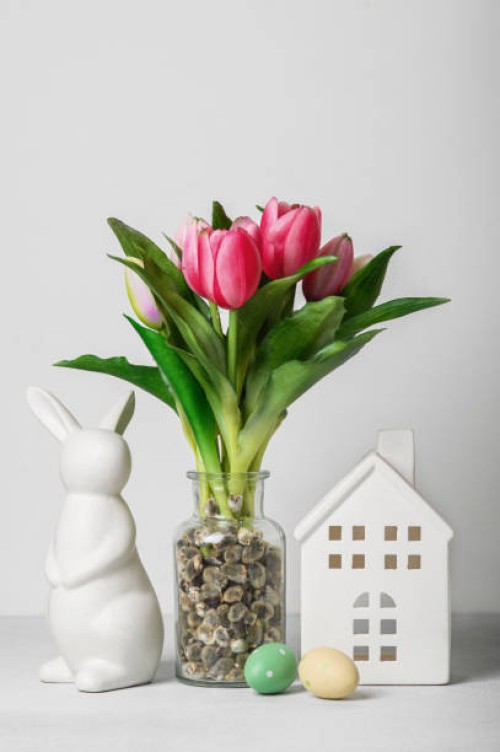 easter greeting card. easter eggs, house, colorful tulips and copy space - home decoration stock pictures, royalty-free photos & images