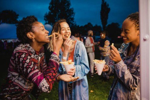 eating chips at a festival - food stock pictures, royalty-free photos & images