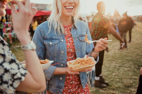 eating food at a festival - food stock pictures, royalty-free photos & images