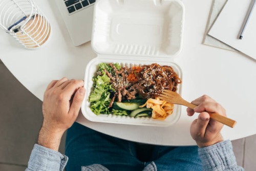 eating healthy lunch bowl in man's hands. delicious balanced food concept. delivery food, home office, dieting, detox. - junk food stock pictures, royalty-free photos & images