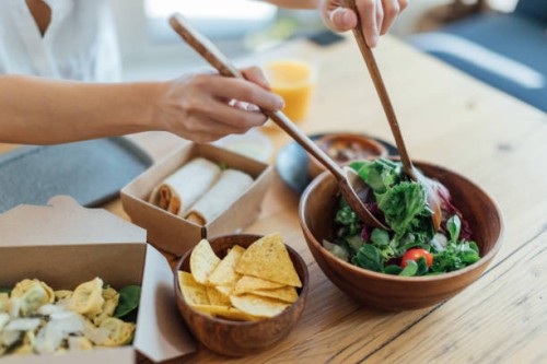 eating healthy takeaway meal at home - junk food stock pictures, royalty-free photos & images