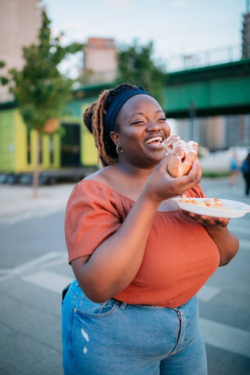 eating on the move - junk food stock pictures, royalty-free photos & images