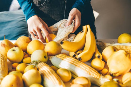 eco friendly shopping mesh bag with fruit. - food stock pictures, royalty-free photos & images