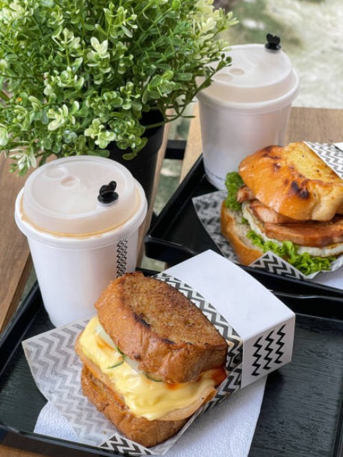 egg and ham sandwich and coffee in disposable cup - junk food stock pictures, royalty-free photos & images