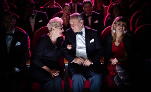 elderly couple talking while sitting in theater - concert stock pictures, royalty-free photos & images