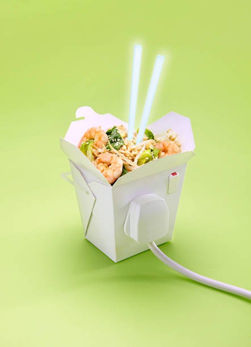 electric takeaway with plug and chopsticks lit up - junk food stock pictures, royalty-free photos & images
