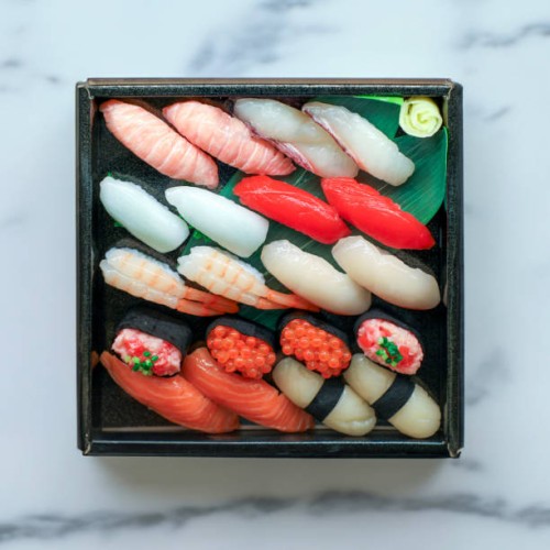elegant assortment of sushi delights - junk food stock pictures, royalty-free photos & images