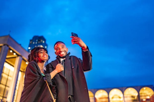 elegant couple at manhattan opera evening - concert stock pictures, royalty-free photos & images