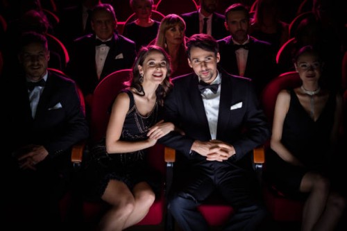 elegant couple watching opera performance - concert stock pictures, royalty-free photos & images