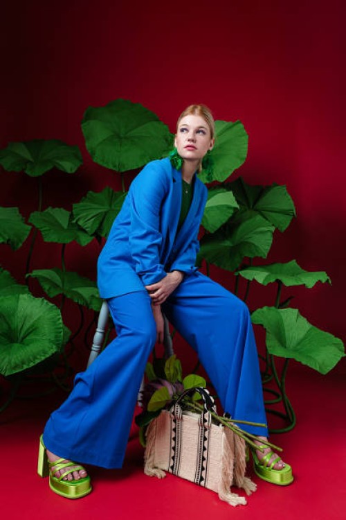 elegant woman wearing blue suit - fashion stock pictures, royalty-free photos & images