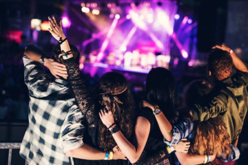 embraced friends are listening to their favorite band together at the music concert - concert stock pictures, royalty-free photos & images