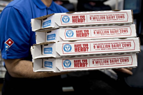 Employee moves pizza boxes before a delivery at a Domino's Pizza Inc. Restaurant in Chantilly, Virginia, U.S., on Tuesday, Feb. 20, 2018. Domino's...