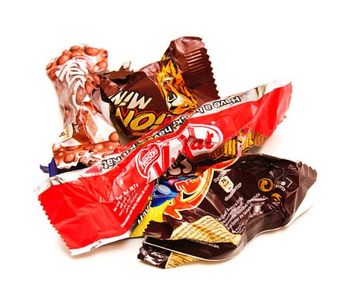 empty and crumpled candy bars - junk food stock pictures, royalty-free photos & images