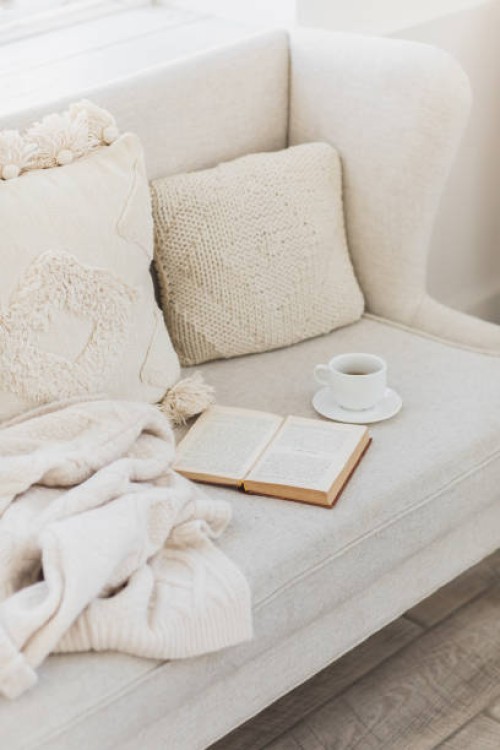 empty couch with beautiful pillow, tea cup and book. - home decoration stock pictures, royalty-free photos & images
