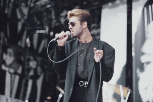 English singer, songwriter and musician, George Michael performs live on stage at the Nelson Mandela 70th Birthday Tribute concert at Wembley Stadium...