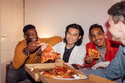 enjoying a pizza together - junk food stock pictures, royalty-free photos & images