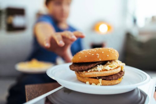 enjoying my favorite cheeseburger right now - food stock pictures, royalty-free photos & images