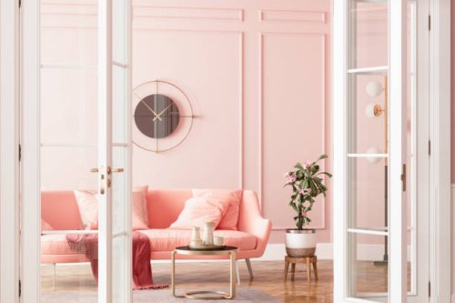 entrance of living room with pink sofa, potted plant and coffee table - home decoration stock pictures, royalty-free photos & images
