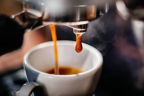 espresso shot pouring out. - coffee stock pictures, royalty-free photos & images