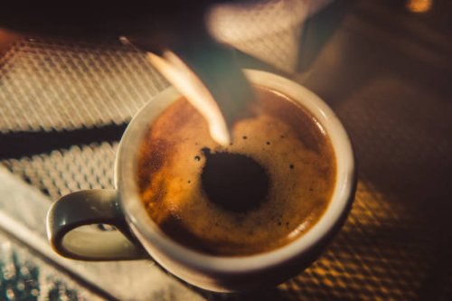espresso shot pouring out of steamy machine. - coffee stock pictures, royalty-free photos & images