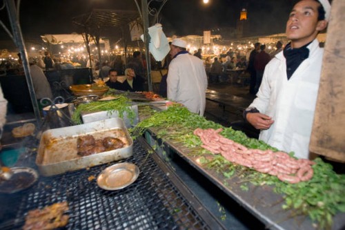 Evening barbecue food stall Place Djemaa El Fna Marrakech Morocco.