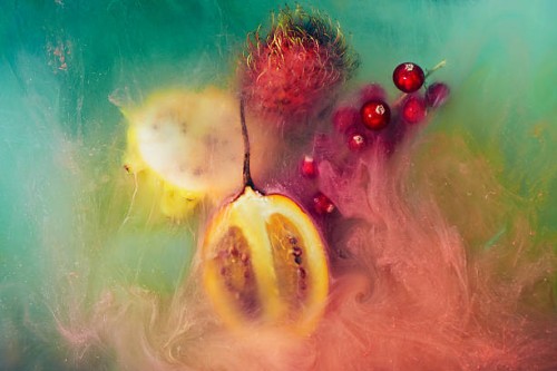 exotic fruit and paint shot underwater - food stock pictures, royalty-free photos & images