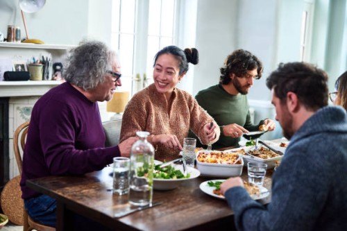 extended family having meal together - food stock pictures, royalty-free photos & images