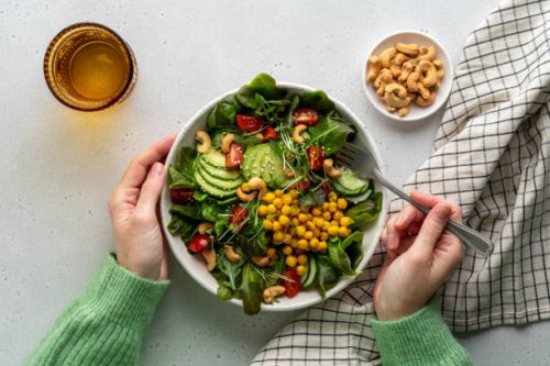 faceless female eating healthy vegan plant-based salad in bowl with fatty acids and dietary fiber - food stock pictures, royalty-free photos & images