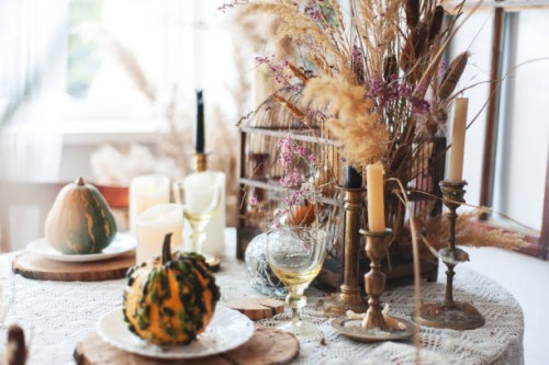 fall decor halloween style table setting with candles, pampas grass, reeds, pumpkins. rustic style - home decoration stock pictures, royalty-free photos & images