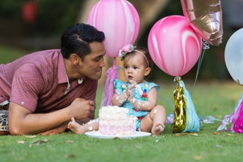 family celebrating baby's first birthday outside at home during pandemic - garden decoration stock pictures, royalty-free photos & images