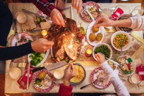 family celebrating christmas at home and playing with sparklers fireworks - food stock pictures, royalty-free photos & images