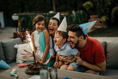 family celebrating the birthday of the little son together - garden decoration stock pictures, royalty-free photos & images