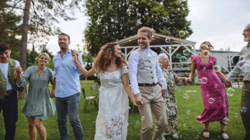 family dancing together at a summer garden party. - garden decoration stock pictures, royalty-free photos & images