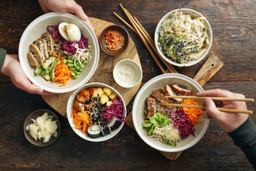 family eating homemade poke bowls and glass noodle salad - junk food stock pictures, royalty-free photos & images
