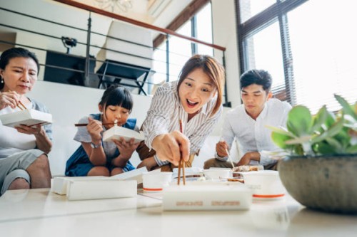 family eating take-out food together - junk food stock pictures, royalty-free photos & images