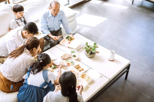 family eating takeout food at home - junk food stock pictures, royalty-free photos & images