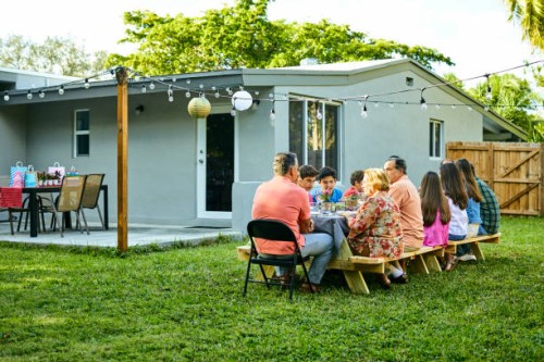 family enjoying birthday party at back yard - garden decoration stock pictures, royalty-free photos & images