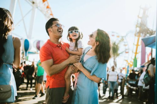 family has fun at outdoor carnival setting - travel stock pictures, royalty-free photos & images