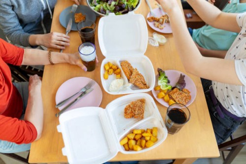 family having delivered meal during covid-19 outbreak - junk food stock pictures, royalty-free photos & images