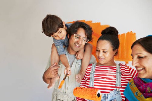 family having fun while renovating home together - home decoration stock pictures, royalty-free photos & images