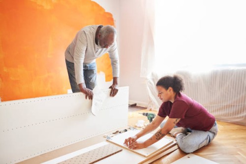 family installing furniture at home - home decoration stock pictures, royalty-free photos & images