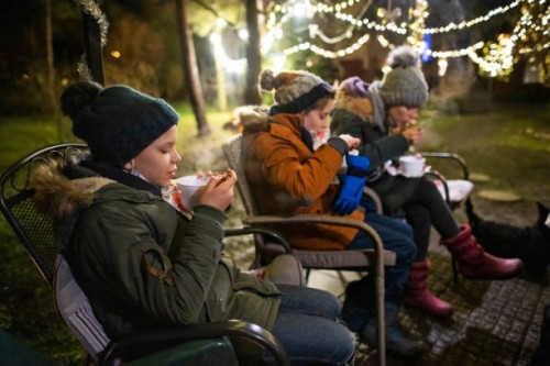 family is having a covid-19 safe christmas eve in the backyard - garden decoration stock pictures, royalty-free photos & images