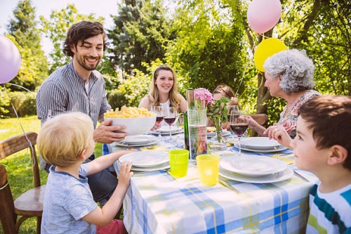 family of three generations at a garden party - garden decoration stock pictures, royalty-free photos & images