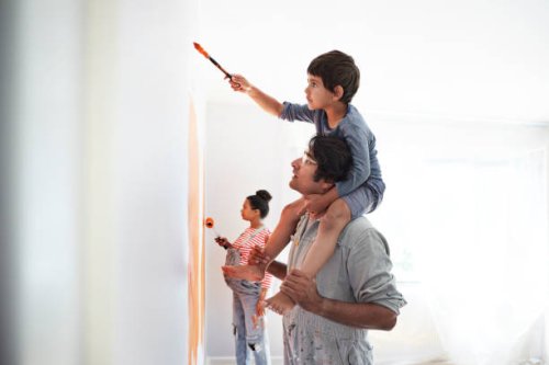 family painting wall during home renovation - home decoration stock pictures, royalty-free photos & images