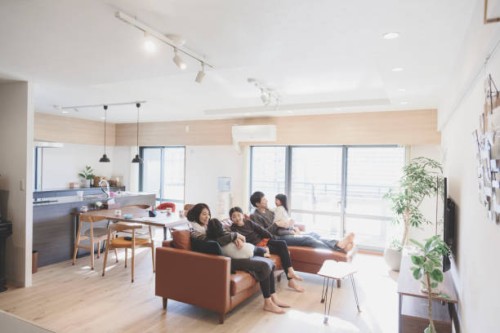 family relaxed on sofa at home - home decoration stock pictures, royalty-free photos & images