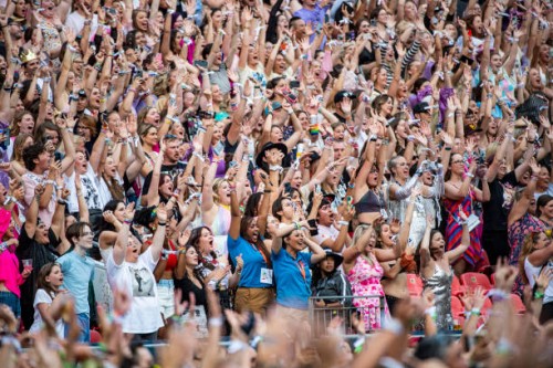 Fans cheer as Taylor Swift performs during night one of The Eras Tour in Empower Field at Mile High in Denver, Colo., on Friday, July 14, 2023....